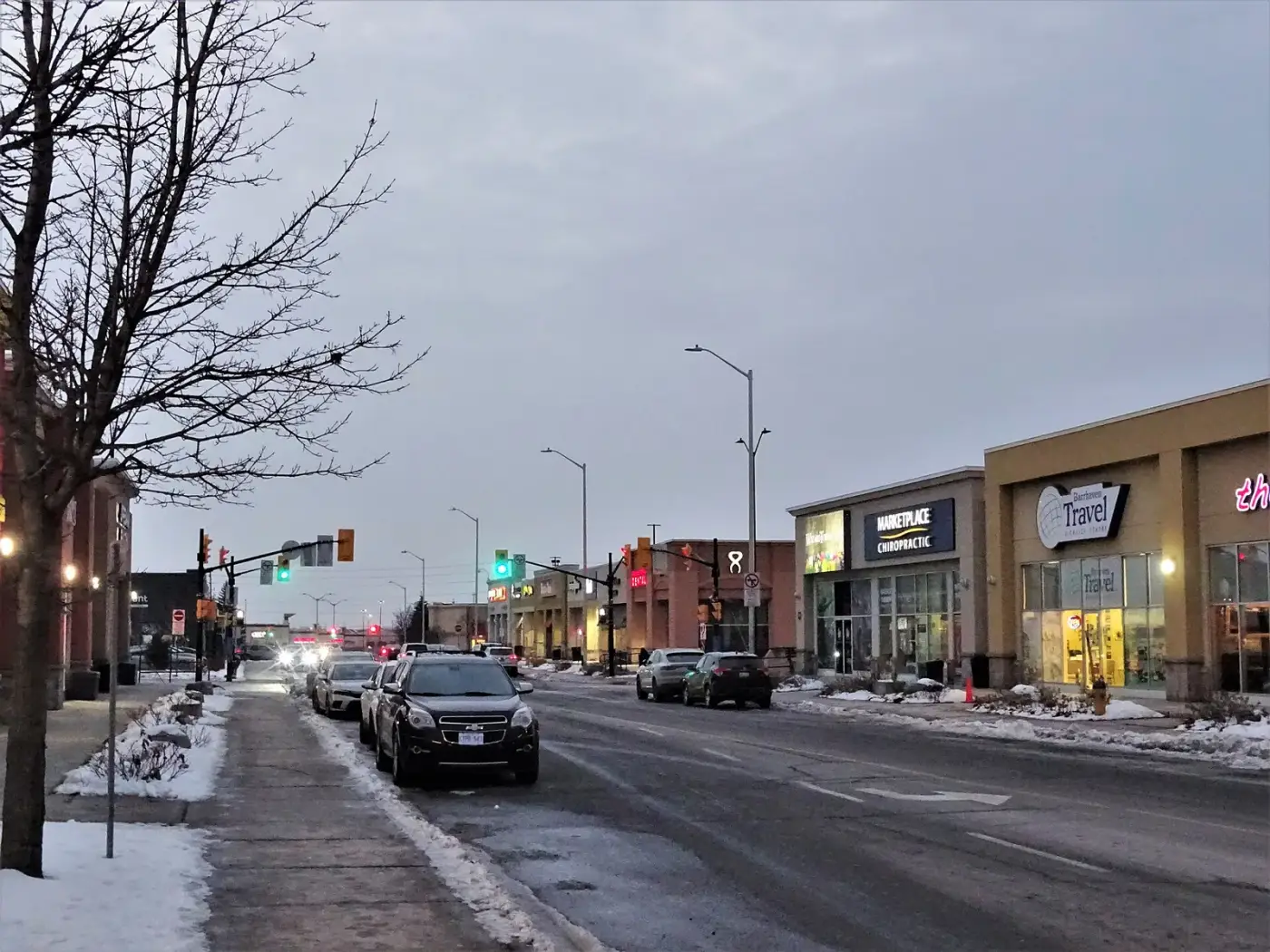 Storefronts and parking at Chapman Mills Marketplace